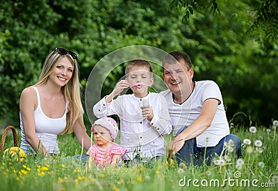 Portrait Of Happy Family In Garden