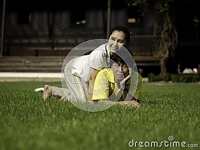 Portrait of a happy family lying on the grass