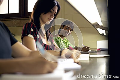 Portrait of happy female student writing, african american woman