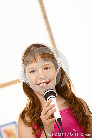 Portrait if young girl with microphone