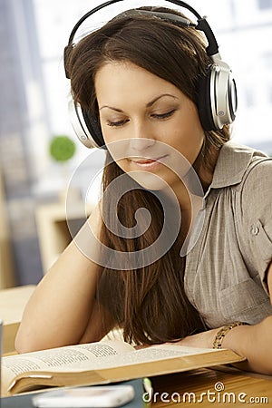 Portrait of learning woman with headphones