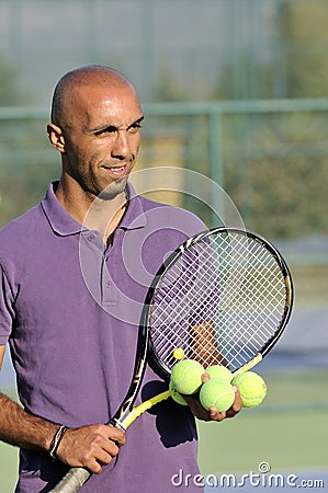 Portrait of a man with tennis racket
