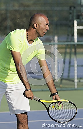 Portrait of a man with tennis racket