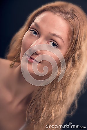 Portrait of natural long blond hair woman with lovely smile and big beautiful eyes