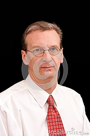 Portrait of older business man in shirt and tie on