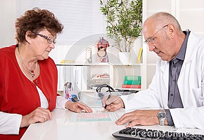 Portrait: older doctor with experience talking with senior woman