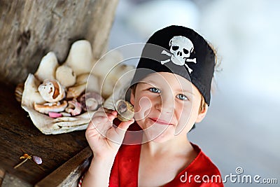 Portrait of playful pirate boy