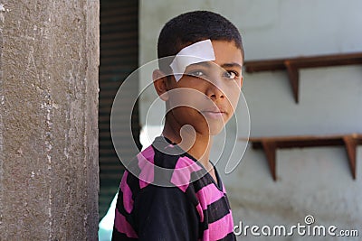 Portrait of a poor boy in the street in giza, egypt