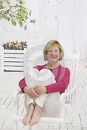 Portrait of relax senior woman sitting outside