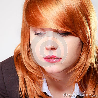 Portrait sad unhappy businesswoman. Closeup face redhaired girl.