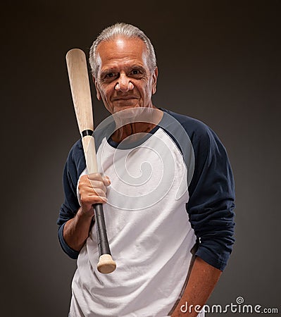 Portrait of a senior man with a baseball bat