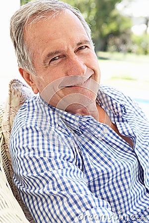 Portrait Of Senior Man Relaxing In Chair