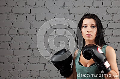 Portrait of sexy boxer girl with gloves on hands