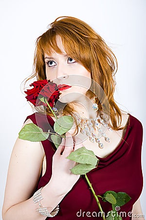 Portrait of sexy retro woman with a rose