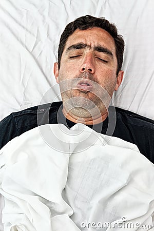 Portrait of a sick hispanic man coughing