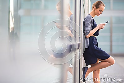 Portrait of a sleek young woman calling on a smartphone