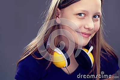 Portrait of a smiling teen girl with headphones