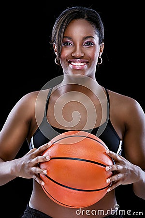 Portrait of smiling woman with basketball