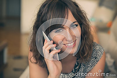 Portrait of Smiling Woman Talking on Cell Phone