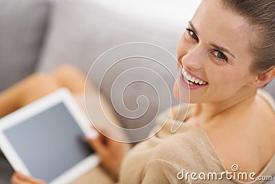 Portrait of smiling young woman with tablet pc