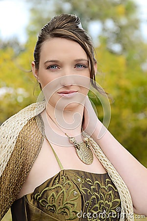 Portrait teen girl in fancy dress outdoors
