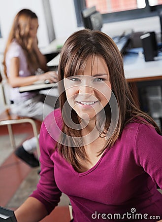 Portrait Of Teenage Girl Smiling In Computer Class