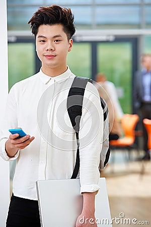 Portrait Of Teenage Male Student In Classroom