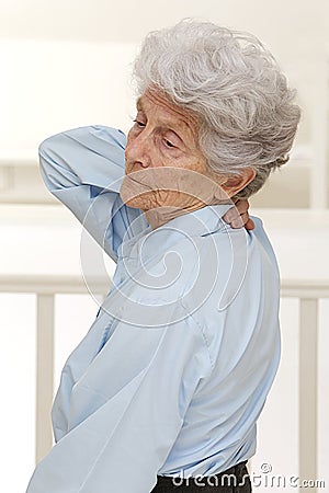 Portrait of an unwell senior woman with neck pain