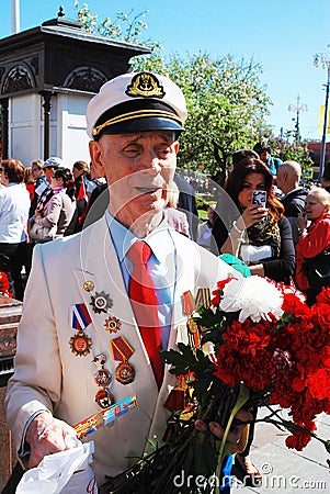 Portrait of a war veteran in white jacket.