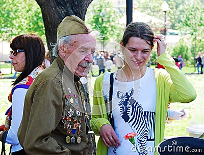 Portrait of a war veteran and a young woman.