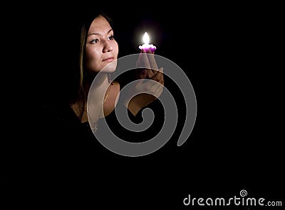 Portrait of yoing woman with candle