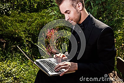Portrait of young beautiful fashionable man outdoor.