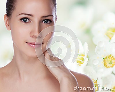 Portrait of young beautiful woman with healthy skin
