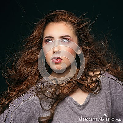 Portrait of young beautiful woman with long flowing hair