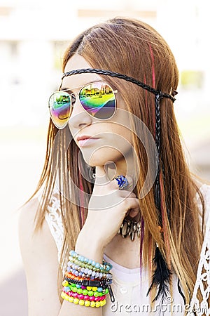 Portrait of young beautiful woman with sunglasses hippie style.