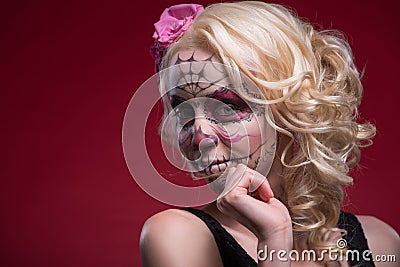 Portrait of young blond girl with Calaveras makeup