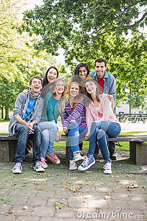 Portrait of young college students in park
