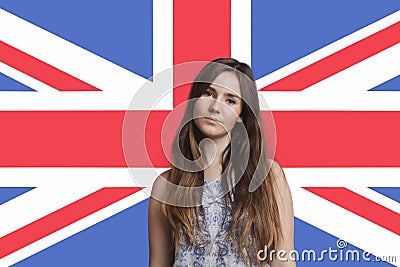 Portrait of young woman against British flag