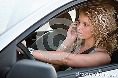 Portrait of young woman driving car