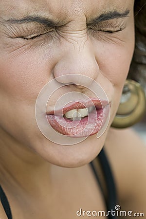 Portrait of young woman making funny expression