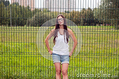 Portrait Of Young Woman Wearing Glasses On Playground