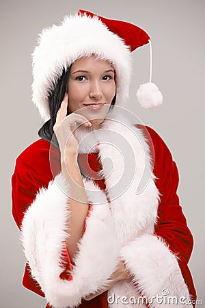 Portrait of young woman wearing santa costume