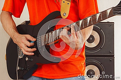 Posing hands of rock musician playing the guitar