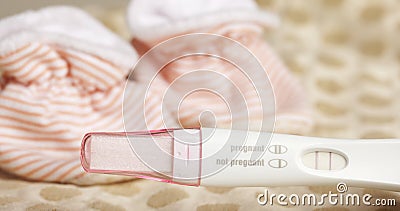 Positive Pregnancy Test and Baby Booties