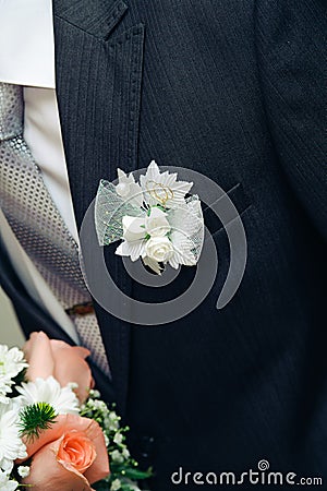 Posy with roses on groom suit