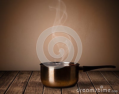 Pot on old wooden table