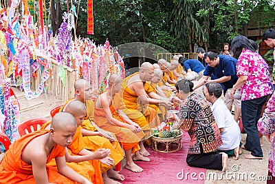 Pouring water to monk