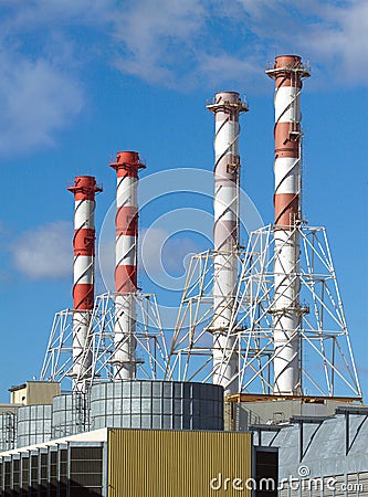 Power station buildings with high industrial pipes vertical view