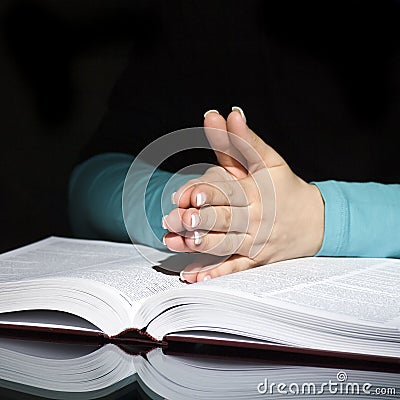 Praying woman and bible