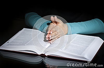 Praying woman and bible